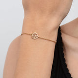 Piaget Rose Bracelet-Piaget Rose Bracelet in 18 karat rose gold with a center diamond weighing 0.01 carats.